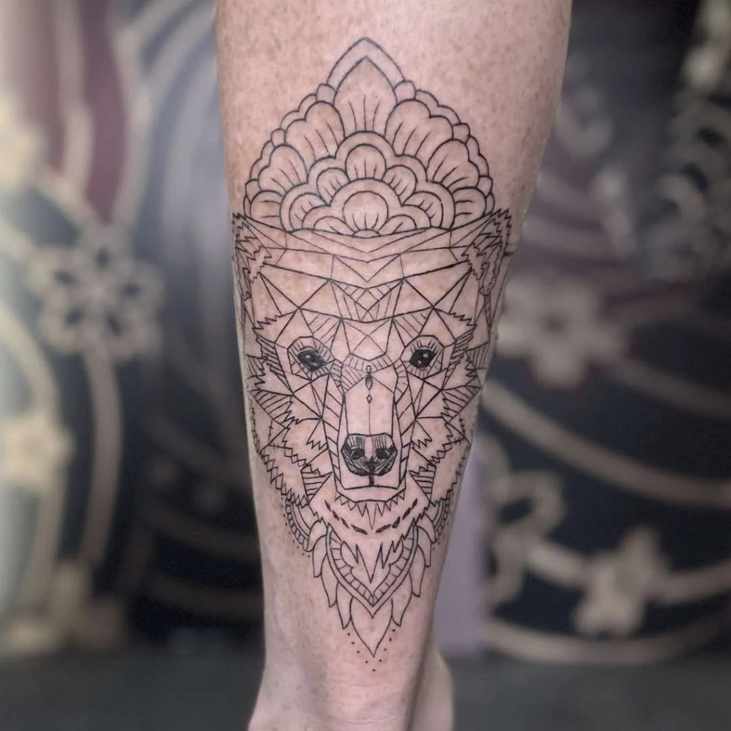 This is a fine line, geometric tattoo of a wolf from the best Canggu tattoo studio.